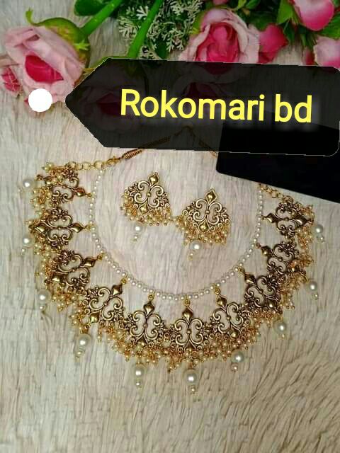 Gorgeous party wear antique golden choker set for girls and women.