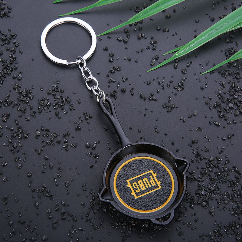 Key chain PUBG helmet pan weapon model pendant peripheral street stall key chain small gifts. 